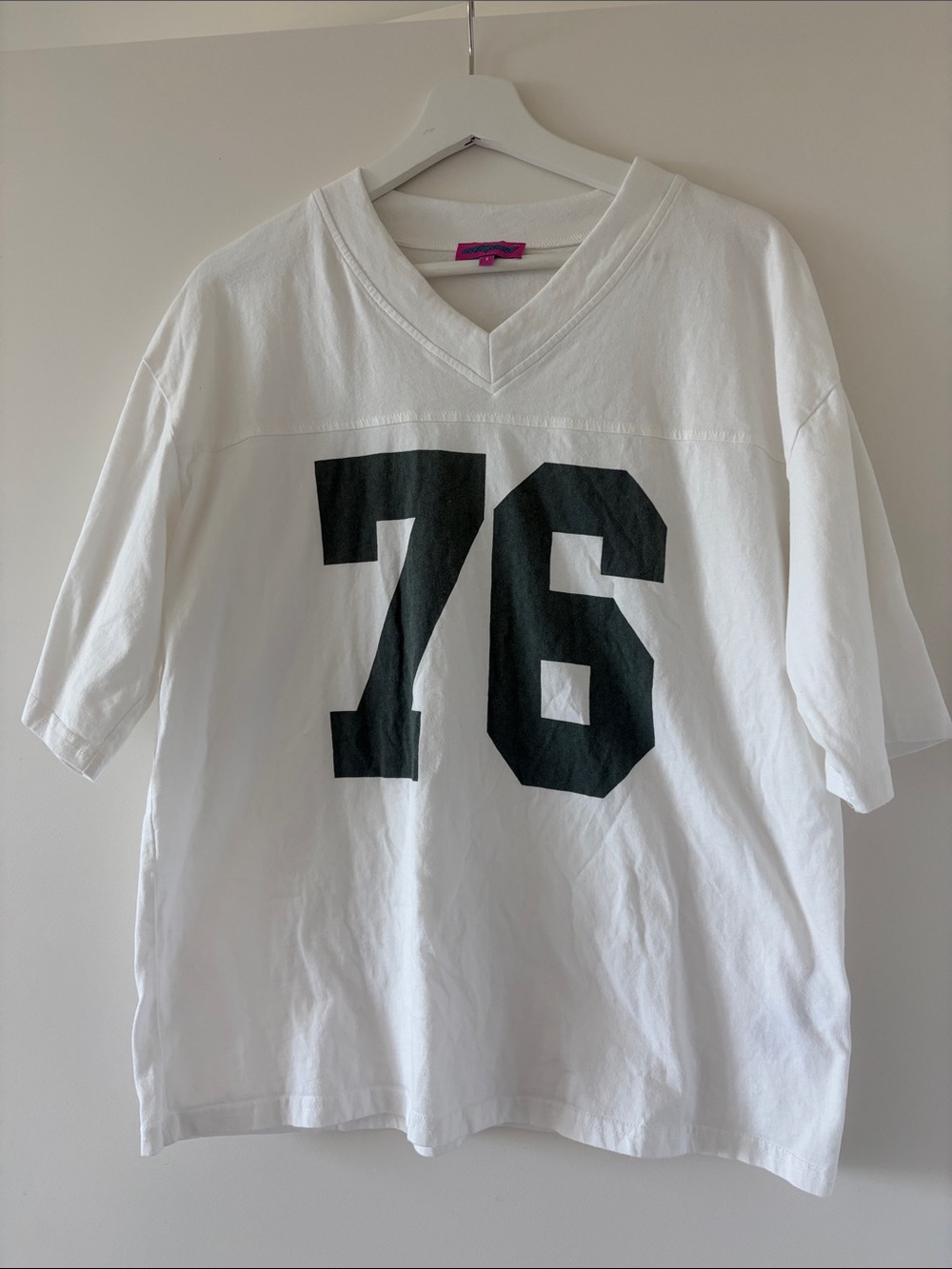 Edikted White V-Neck Football Tee with Green 76 Graphic